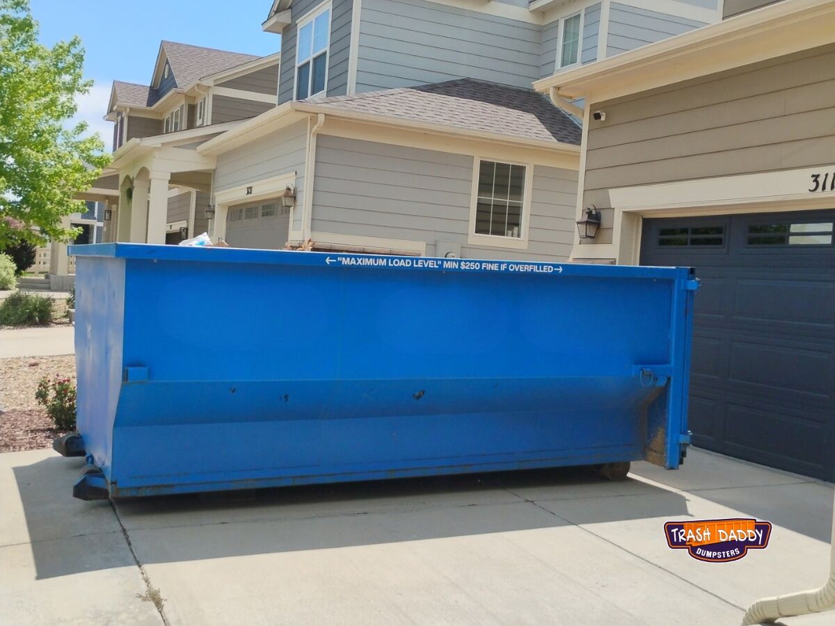 15 yard roll off dumpster in a driveway