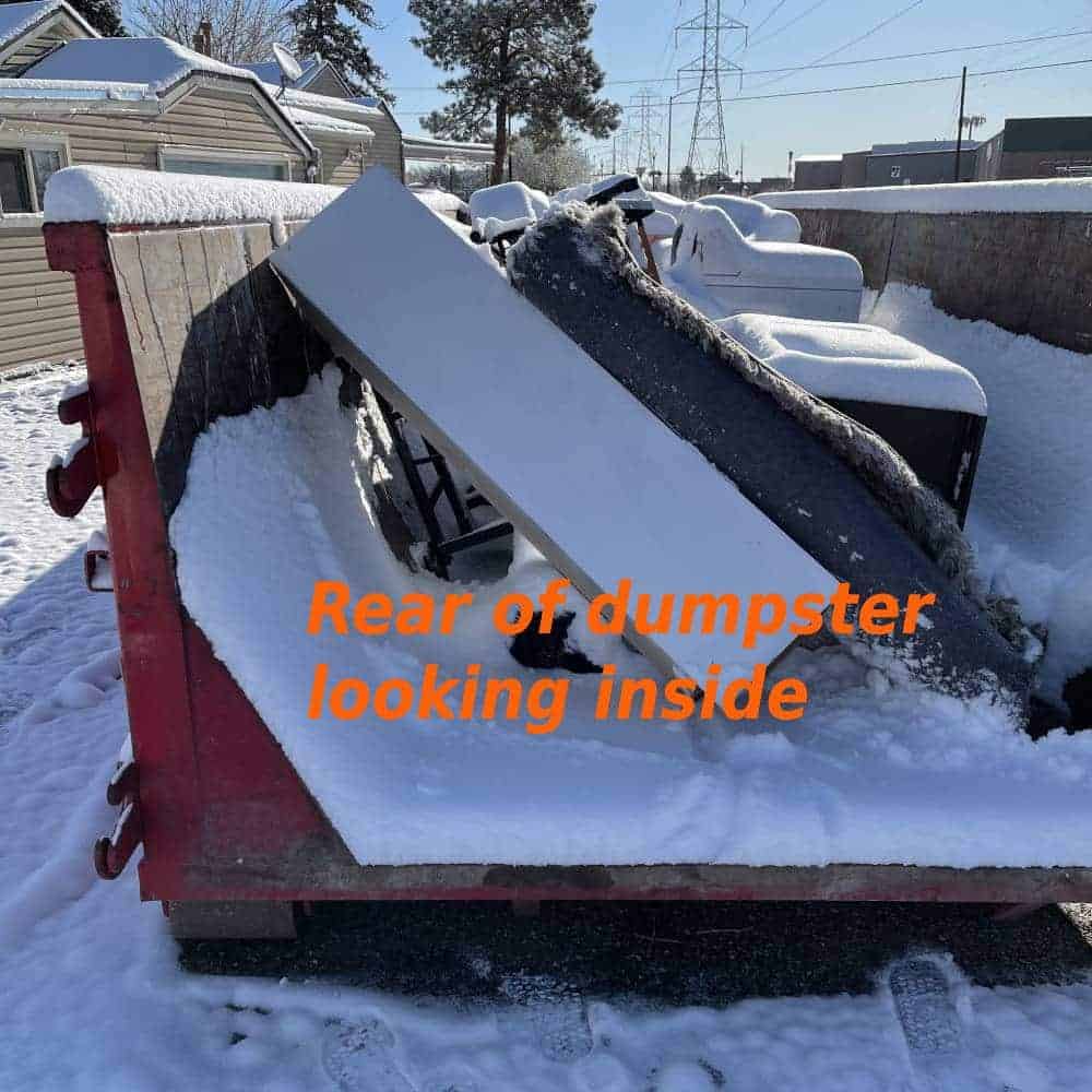 inside of 15 yard dumpster from the rear