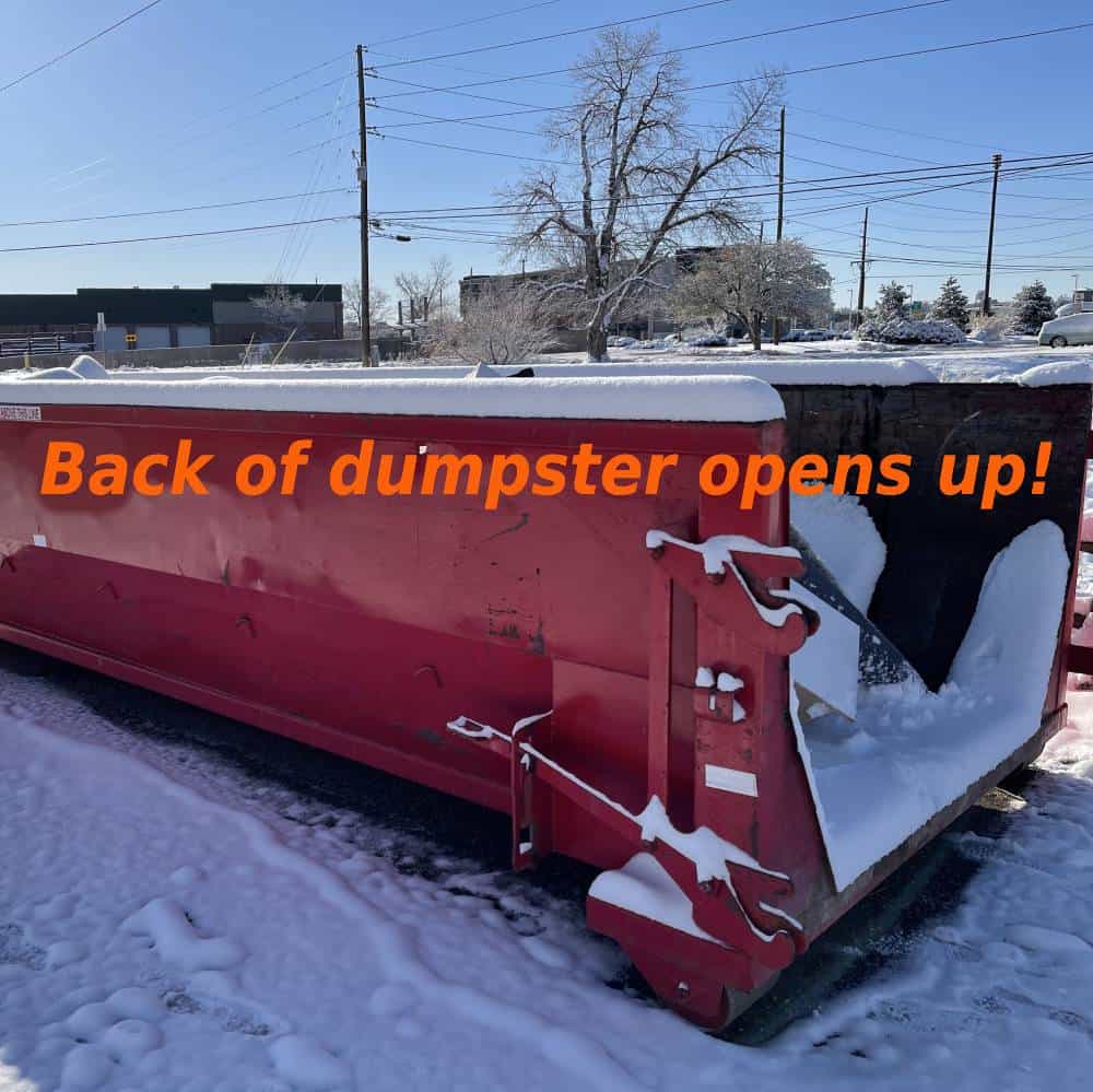 red 15 yard dumpster rental in winter with door open